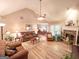 Open-concept living space with seamless flow between living, dining, and fireplace at 6830 Peeksville Rd, Mcdonough, GA 30252