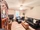 Comfortable living room featuring modern furnishings, neutral paint, and laminate floors at 6830 Peeksville Rd, Mcdonough, GA 30252