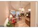 Spacious living room featuring a brick fireplace, ceiling fan, and wood-look flooring, perfect for relaxation at 6830 Peeksville Rd, Mcdonough, GA 30252
