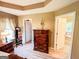A main bedroom featuring a dresser and doorways to a walk-in closet and ensuite bathroom at 6830 Peeksville Rd, Mcdonough, GA 30252