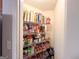 Walk-in pantry with metal shelving and ample storage space for food and supplies at 6830 Peeksville Rd, Mcdonough, GA 30252
