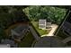 Aerial view of a home with large yard, driveway, and mature trees at 1600 Coal Shovel Ne Trl, Conyers, GA 30013