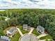 Aerial view showcasing a home surrounded by lush greenery and mature trees at 1600 Coal Shovel Ne Trl, Conyers, GA 30013