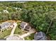 Aerial view of a home on a tree-lined cul-de-sac in a wooded neighborhood at 1600 Coal Shovel Ne Trl, Conyers, GA 30013