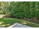 Lush backyard featuring grass and a wooden fence at 1600 Coal Shovel Ne Trl, Conyers, GA 30013