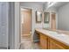Bathroom with wood vanity, white sink and two mirrors at 1600 Coal Shovel Ne Trl, Conyers, GA 30013