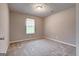 Neutral bedroom features carpet floors, a window with blinds, and is freshly painted at 1600 Coal Shovel Ne Trl, Conyers, GA 30013