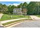 Charming two-story home featuring a well-manicured lawn and classic green shutters at 1600 Coal Shovel Ne Trl, Conyers, GA 30013