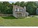 Charming two-story home featuring a well-manicured lawn and classic green shutters at 1600 Coal Shovel Ne Trl, Conyers, GA 30013