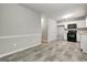 Spacious kitchen/dining combo with updated appliances and a neutral color palette at 1600 Coal Shovel Ne Trl, Conyers, GA 30013