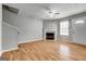 Inviting living room features fireplace, wood floors, and a bright, airy atmosphere at 1600 Coal Shovel Ne Trl, Conyers, GA 30013