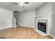 Open-concept living area with a fireplace, staircase, and modern neutral paint at 1600 Coal Shovel Ne Trl, Conyers, GA 30013