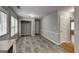 Bright room boasts gray flooring, an in-unit laundry area, and multiple access doors at 1600 Coal Shovel Ne Trl, Conyers, GA 30013