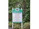 Community sign displaying amenities including a zero-entry mega pool, lighted tennis courts and walking trails at 345 Kerrith Drive Dr, Stockbridge, GA 30281