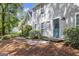 Charming home exterior featuring a teal front door and well-maintained landscaping at 345 Kerrith Drive Dr, Stockbridge, GA 30281