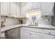 Kitchen with white cabinetry, subway tile backsplash, and stainless steel dishwasher at 345 Kerrith Drive Dr, Stockbridge, GA 30281