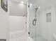 Modern bathroom featuring a walk-in glass enclosed shower and white subway tile at 3612 Bill Gardner Pkwy, Locust Grove, GA 30248
