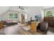 Spacious bedroom with a ceiling fan, a large window, and wood-look floors at 3612 Bill Gardner Pkwy, Locust Grove, GA 30248