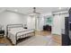 Bedroom featuring wood floors, ceiling fan, and lots of natural light at 3612 Bill Gardner Pkwy, Locust Grove, GA 30248