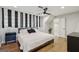 Modern bedroom featuring unique window treatments, wood floors and ceiling fan at 3612 Bill Gardner Pkwy, Locust Grove, GA 30248