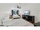 Well-lit bedroom with wood floors, ceiling fan, and ample space at 3612 Bill Gardner Pkwy, Locust Grove, GA 30248