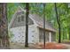 Carriage style garage doors and stone facade on garage at 3612 Bill Gardner Pkwy, Locust Grove, GA 30248