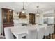 Gourmet kitchen featuring a large island, custom cabinets, stainless steel appliances, and pendant lighting at 3612 Bill Gardner Pkwy, Locust Grove, GA 30248