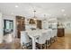 Beautiful kitchen with large island, custom cabinets, stainless steel appliances and bright lighting at 3612 Bill Gardner Pkwy, Locust Grove, GA 30248