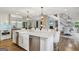 Open concept kitchen with large island, stainless appliances, and sight lines to the living spaces at 3612 Bill Gardner Pkwy, Locust Grove, GA 30248