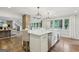 Spacious kitchen with island, stainless steel appliances, breakfast bar, and lots of light at 3612 Bill Gardner Pkwy, Locust Grove, GA 30248