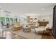 Bright and airy living room with shiplap walls, comfortable seating, and an open floor plan at 3612 Bill Gardner Pkwy, Locust Grove, GA 30248