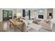 Cozy living room with hardwood floors, fireplace, comfortable seating and a rustic table at 3612 Bill Gardner Pkwy, Locust Grove, GA 30248