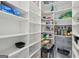 Walk-in pantry with ample shelving and storage space at 3612 Bill Gardner Pkwy, Locust Grove, GA 30248