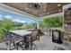 Enjoy outdoor dining in this pavilion with a full kitchen and bar, perfect for entertaining guests at 3612 Bill Gardner Pkwy, Locust Grove, GA 30248