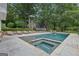 Backyard with in-ground pool, lounge chairs and lush landscaping, perfect for relaxing and entertaining at 3612 Bill Gardner Pkwy, Locust Grove, GA 30248