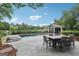 Relaxing backyard oasis with pool, outdoor dining, and pavilion offers serene views and ample entertaining space at 3612 Bill Gardner Pkwy, Locust Grove, GA 30248