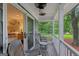 Relaxing covered porch with seating area that overlooks a lake at 3612 Bill Gardner Pkwy, Locust Grove, GA 30248