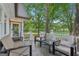 Covered porch with chairs and serene views of the lake at 3612 Bill Gardner Pkwy, Locust Grove, GA 30248