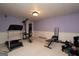 Basement gym area with exercise equipment on neutral carpet, providing a dedicated space for workouts at 12043 Olmstead Dr, Fayetteville, GA 30215
