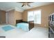 Bedroom featuring a bed, area rug, and natural light in a neutral color scheme at 12043 Olmstead Dr, Fayetteville, GA 30215