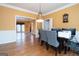 Bright dining area featuring hardwood floors and a decorative chandelier, ideal for Gathering meals and gatherings at 12043 Olmstead Dr, Fayetteville, GA 30215