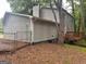Home exterior with grey siding, a back entrance, and a small deck at 4514 Tifton Ct, Powder Springs, GA 30127