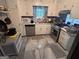 Functional kitchen with cabinets, appliances, and a window at 4514 Tifton Ct, Powder Springs, GA 30127