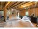 An unfinished basement with exposed beams and a concrete floor at 360 Grandmas Ln, Fayetteville, GA 30215