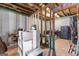 An unfinished basement with exposed beams and a concrete floor at 360 Grandmas Ln, Fayetteville, GA 30215