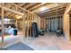 Unfinished basement with exposed framing, offering ample potential for customization and storage space at 360 Grandmas Ln, Fayetteville, GA 30215