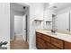 Bathroom featuring neutral-toned vanity with a tile floor and a large mirror at 360 Grandmas Ln, Fayetteville, GA 30215