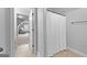 Hallway bathroom with a white shower curtain, adjacent to a well-lit bonus room at 360 Grandmas Ln, Fayetteville, GA 30215
