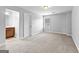 Bright and airy bedroom with neutral walls, carpet, and an ensuite bath at 360 Grandmas Ln, Fayetteville, GA 30215