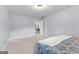 A bright bedroom with carpet and a bed with blue and white covers at 360 Grandmas Ln, Fayetteville, GA 30215
